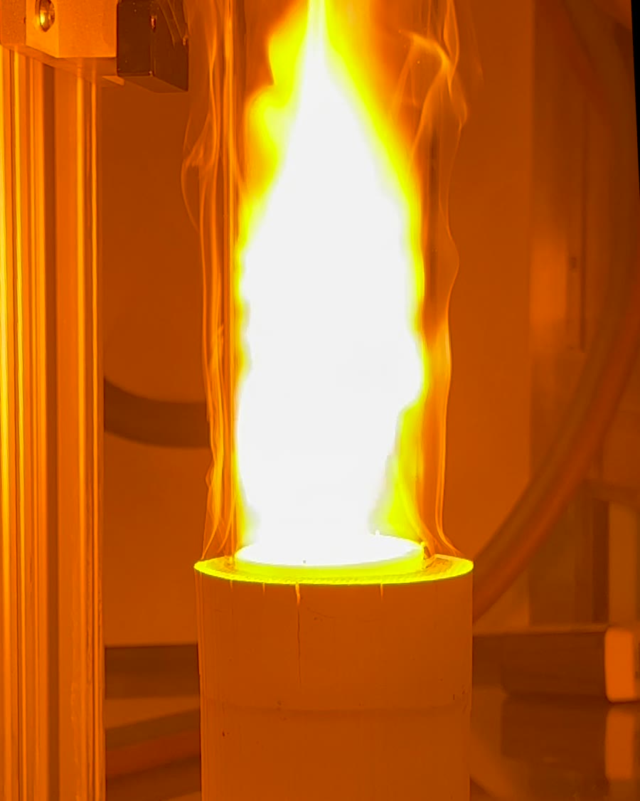 Flame tongues visible inside the glowing quartz column during a color sweep